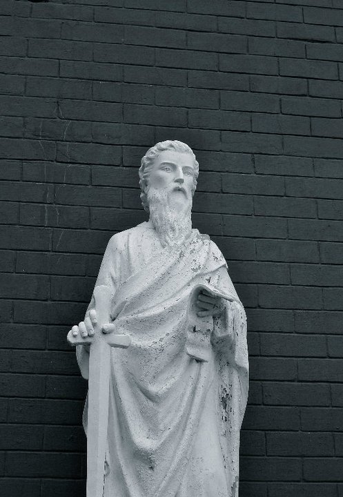 a black and white po of a statue of jesus