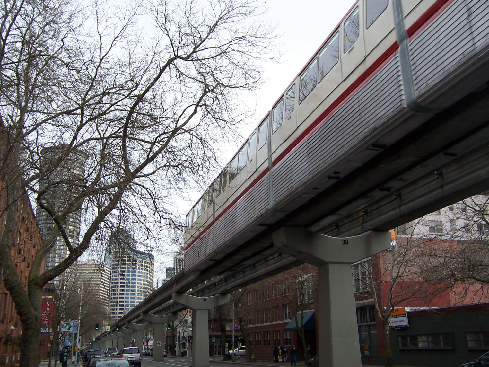 an elevated train sits on top of a bridge