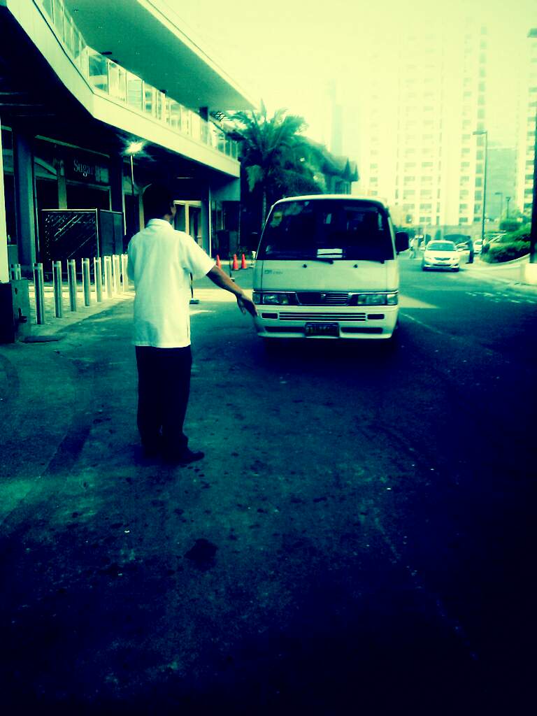 a person holds his hand out to a van