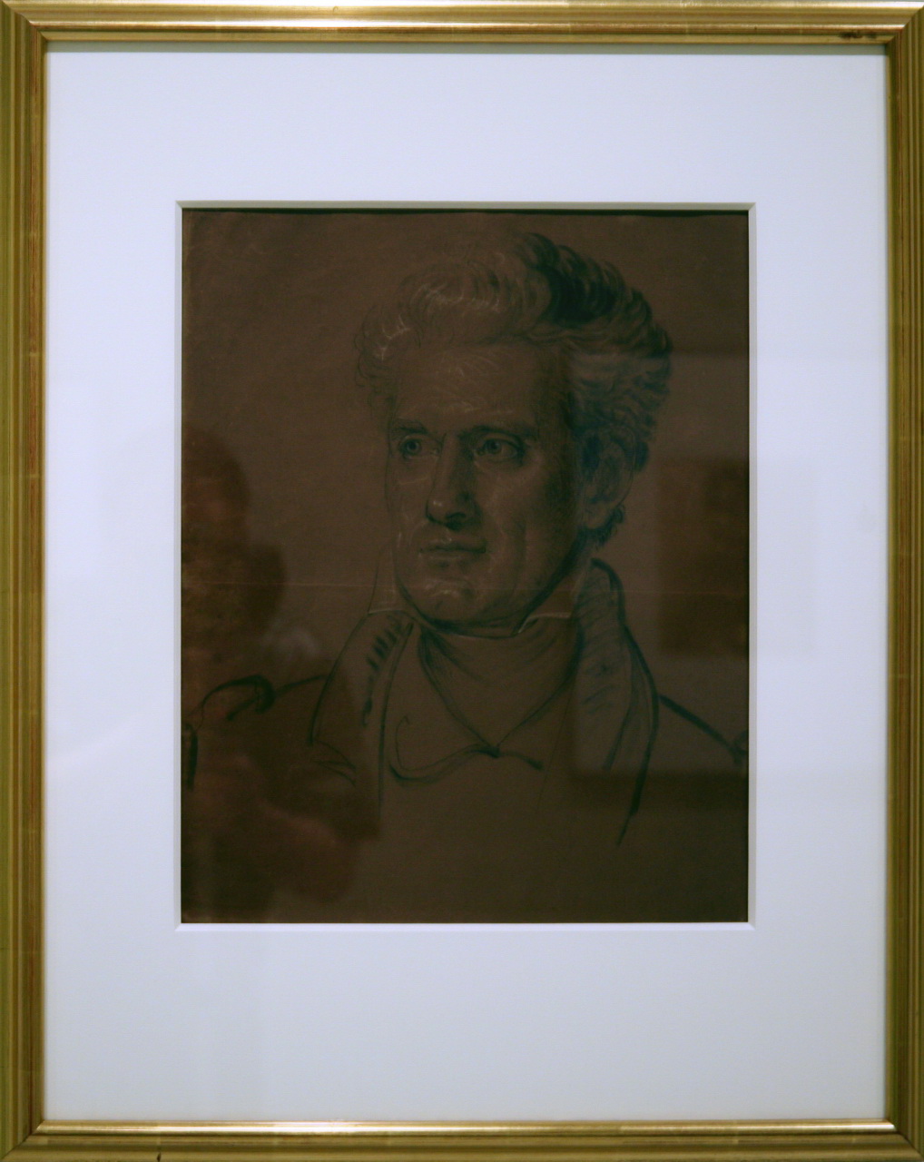 a framed portrait of a man holding a cigarette