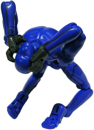 a small action figure posed wearing a blue suit