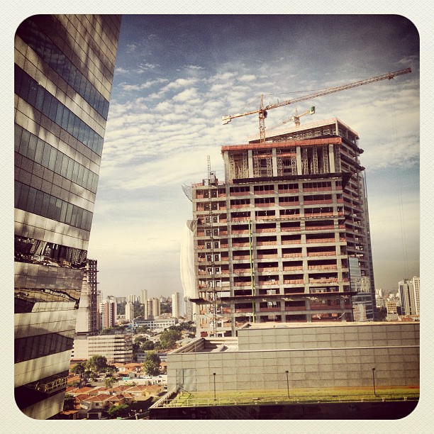 the building is under construction near many other buildings