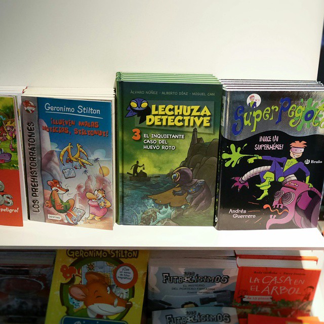 childrens books are lined up in a book case