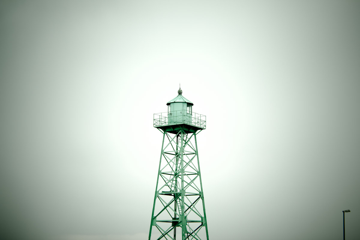 a tower sits on a foggy day