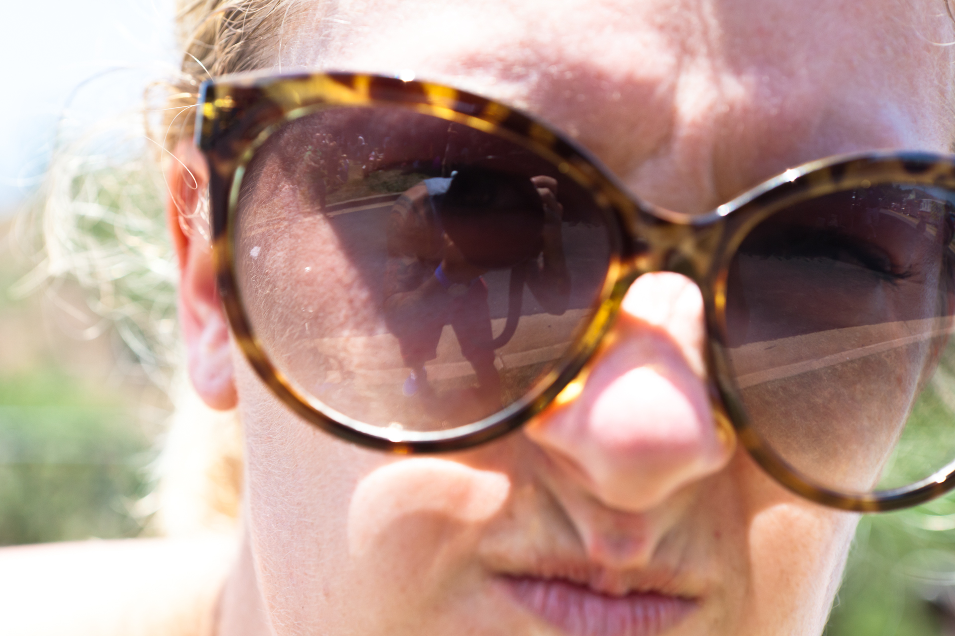 a close up of a person wearing sunglasses