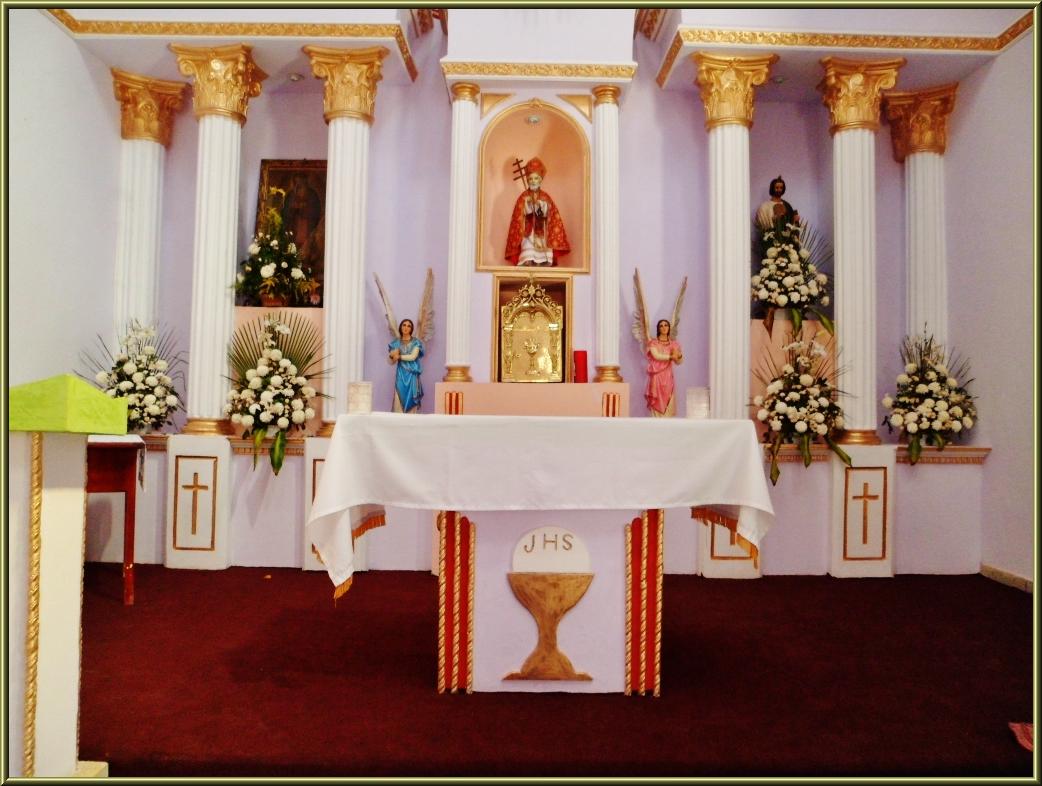 an altar decorated with decorations and flowers in a room