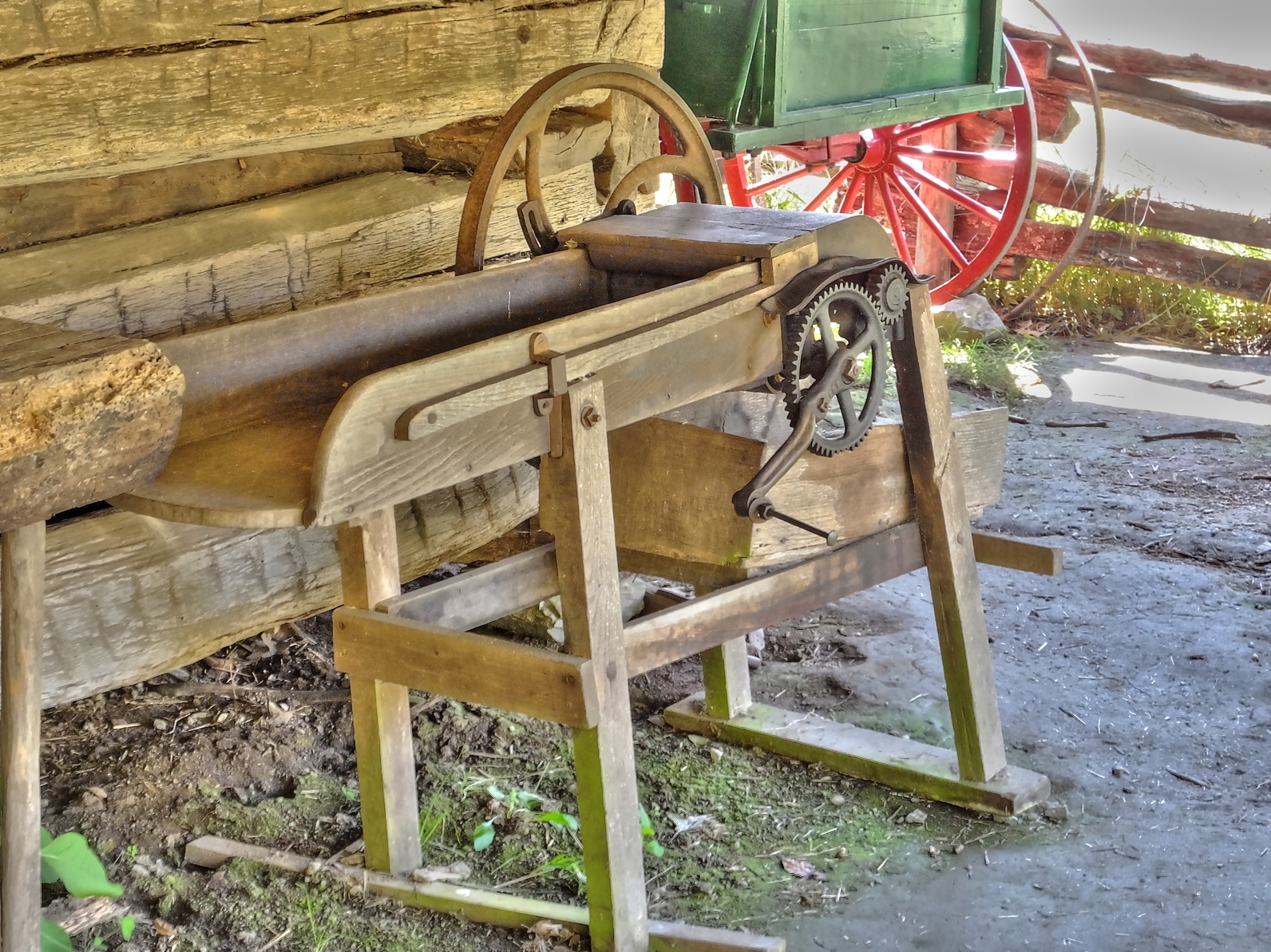 an old antique wooden work bench and machine
