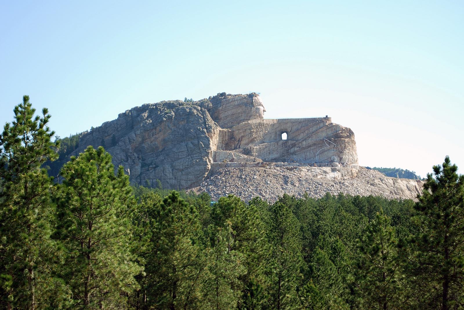 a mountain with a few trees on each side