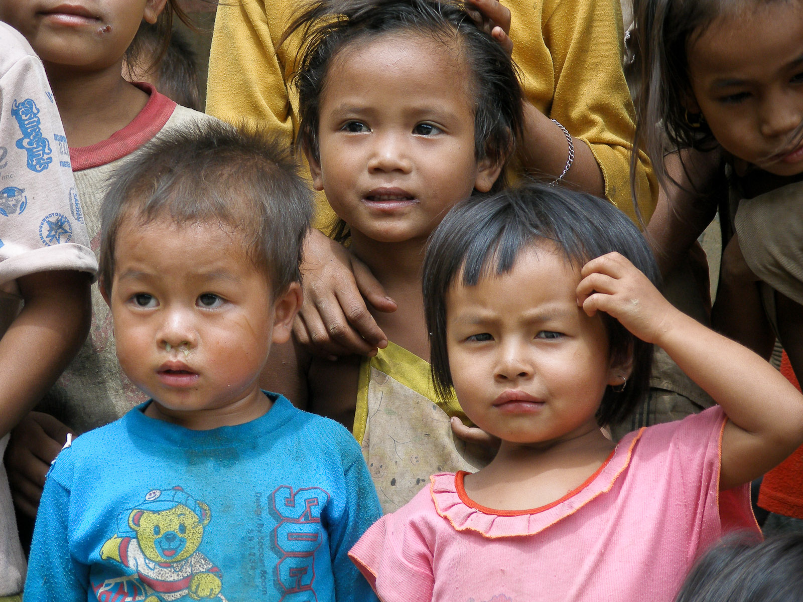 a group of children that are standing together