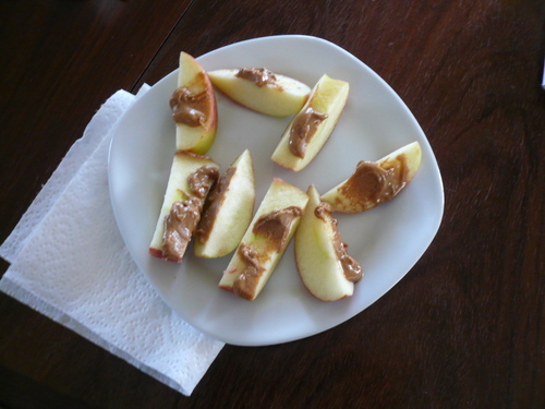 there are slices of apple on a white plate