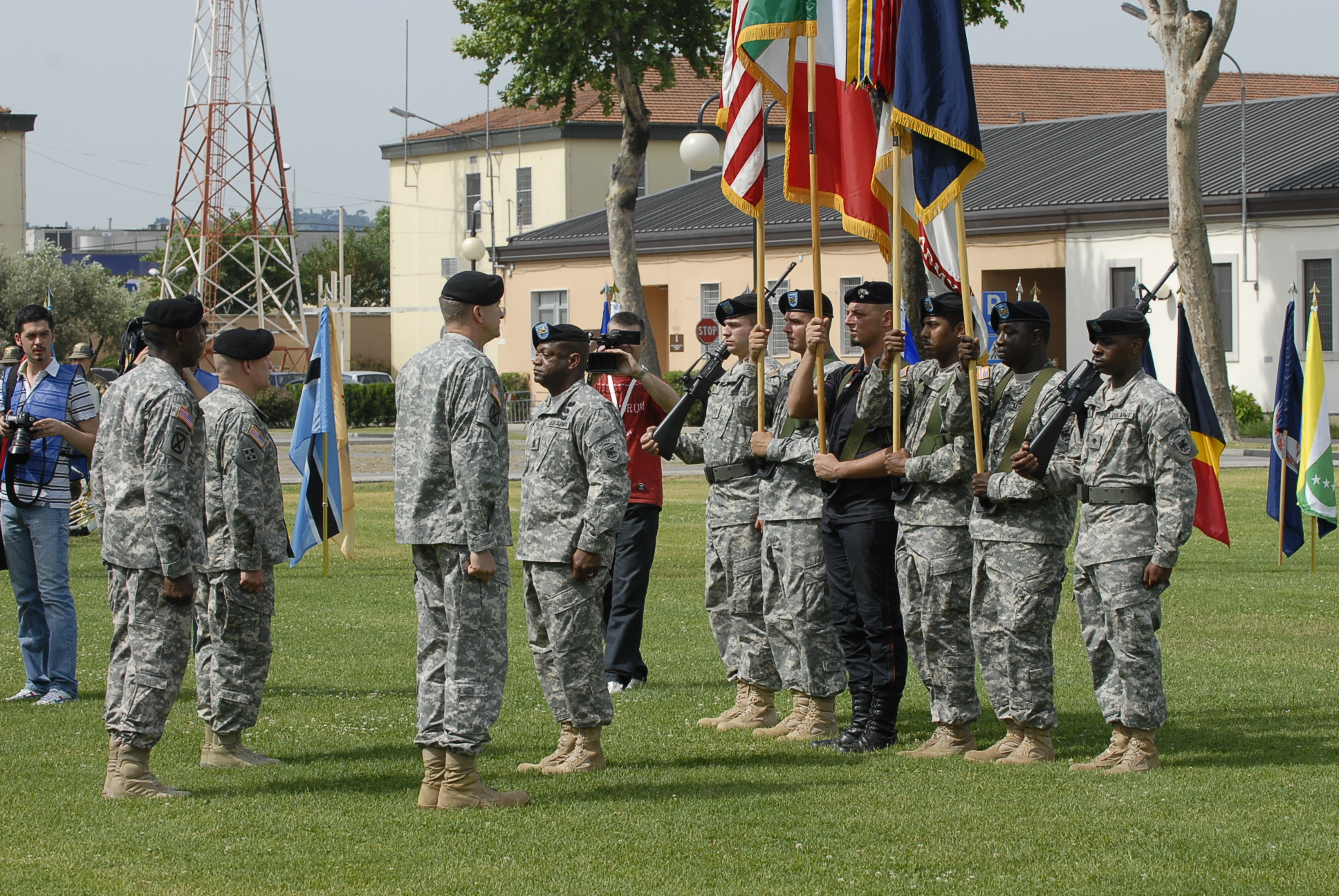 military men and women from the army holding flags