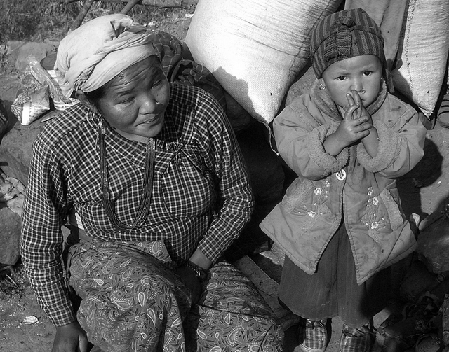 black and white pograph of two women and child
