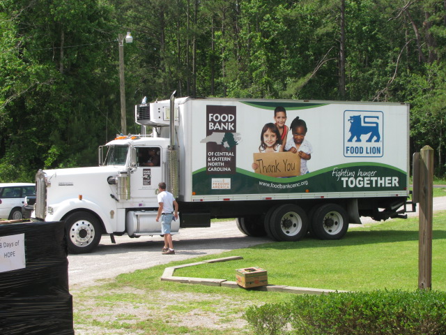 a truck that is driving down a street