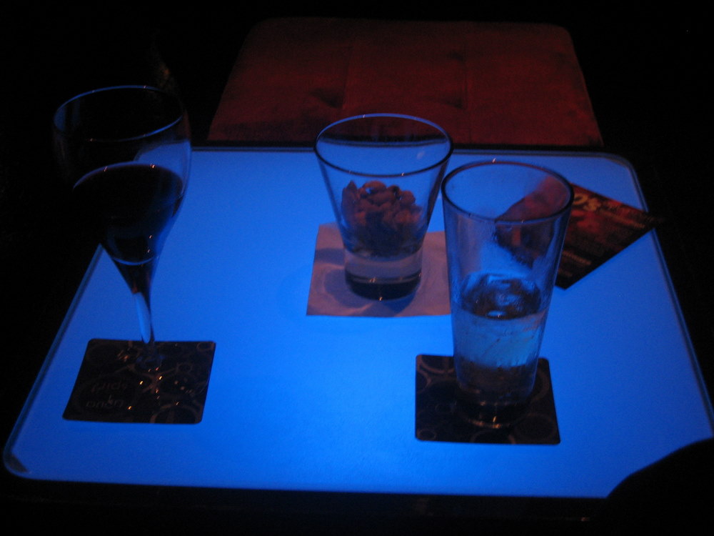 a tray with two glasses on it filled with liquid