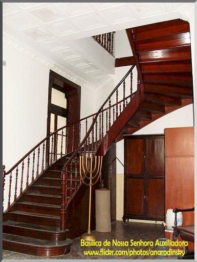 the inside view of a staircase and hall of a home