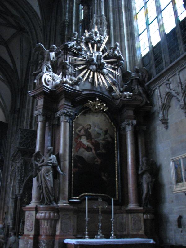 a beautiful old church with some statues on it