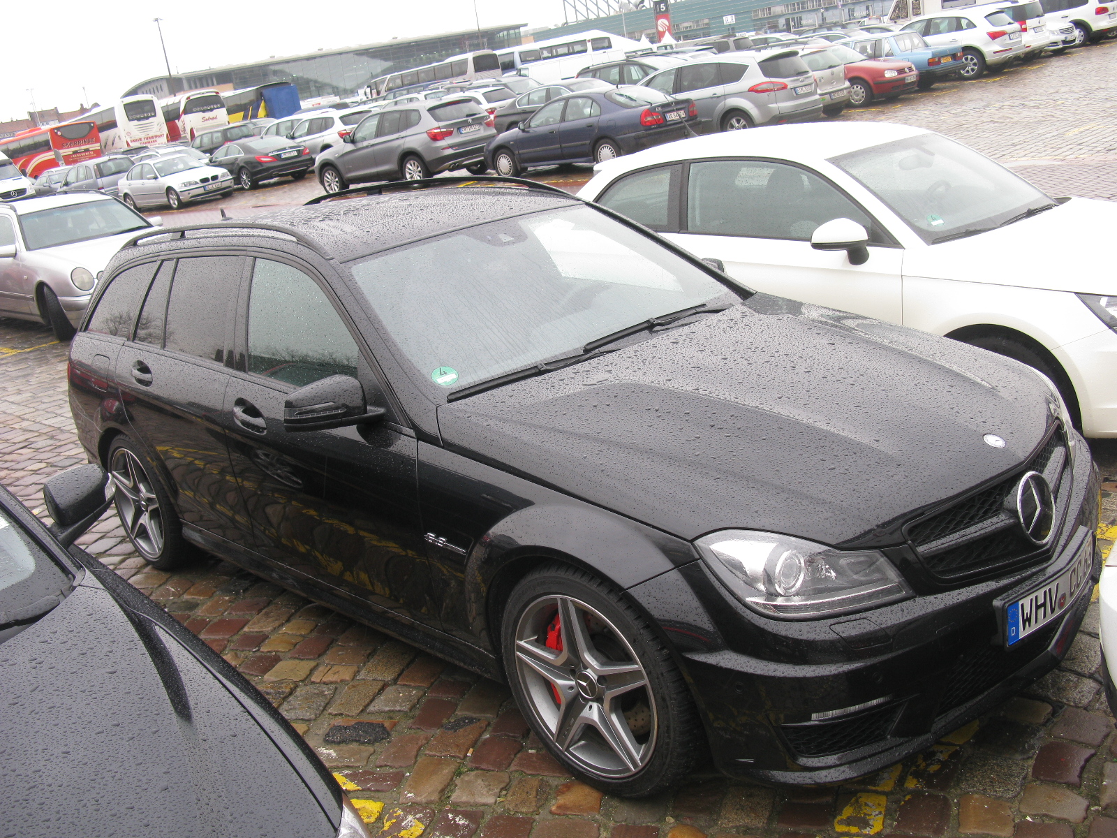 a black mercedes with some kind of hood on it