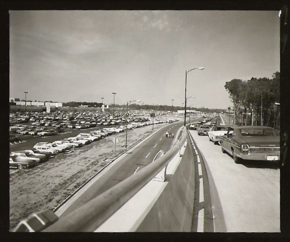 a long freeway with lots of parked cars