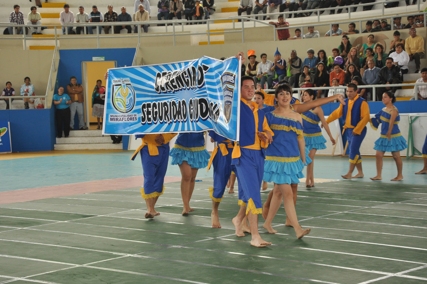 three groups of young men in blue and yellow cheer