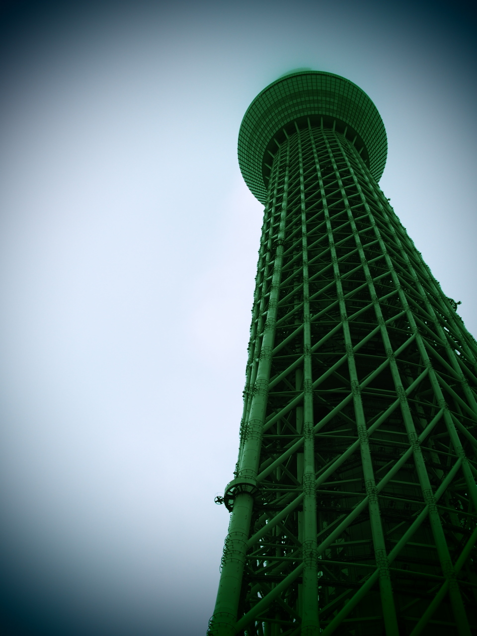 the sky is very dark on this very tall tower