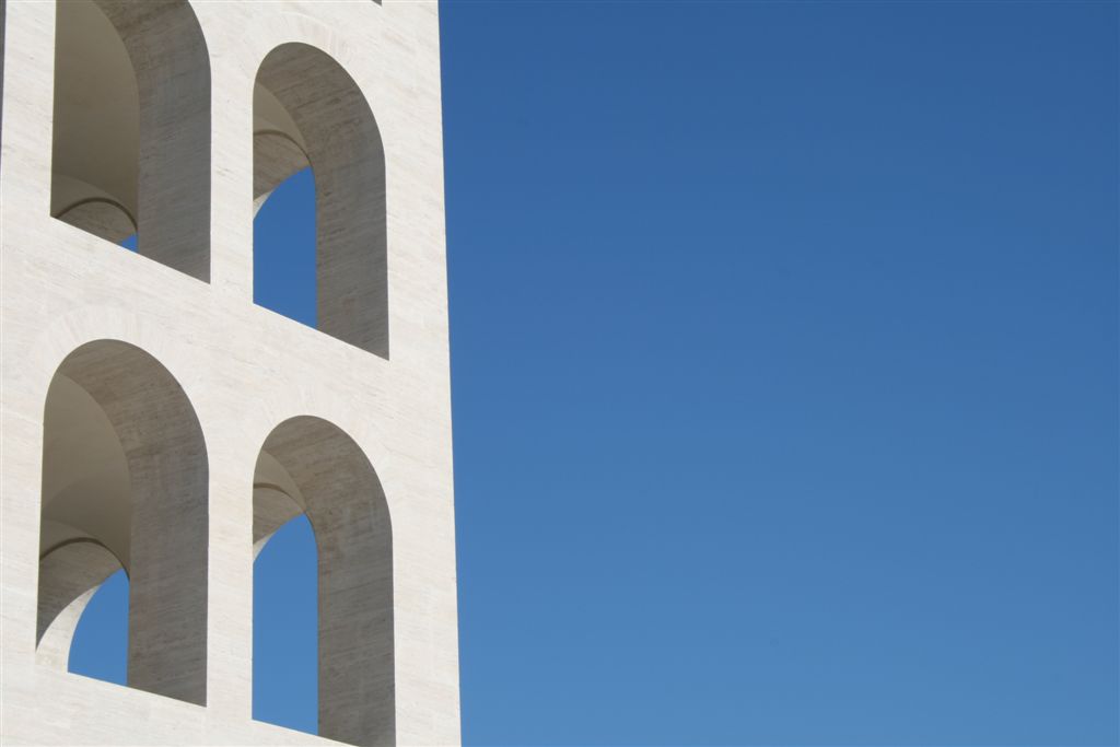 a clock tower on the side of a tall building