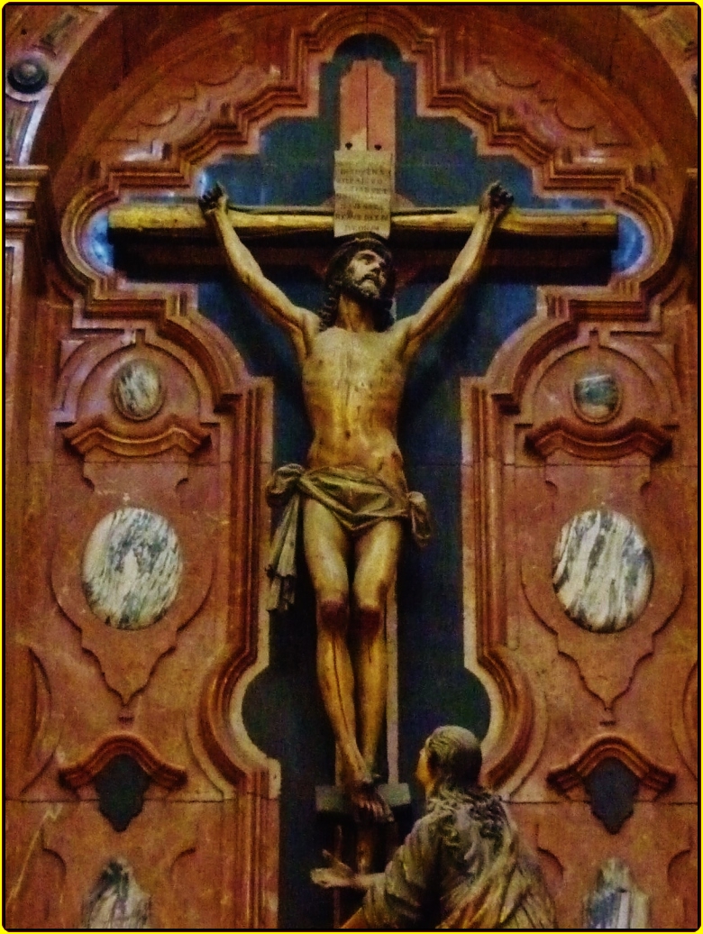the cross has two men on it