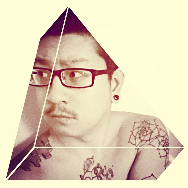 a man is posing for the camera in a po with a triangle shaped face