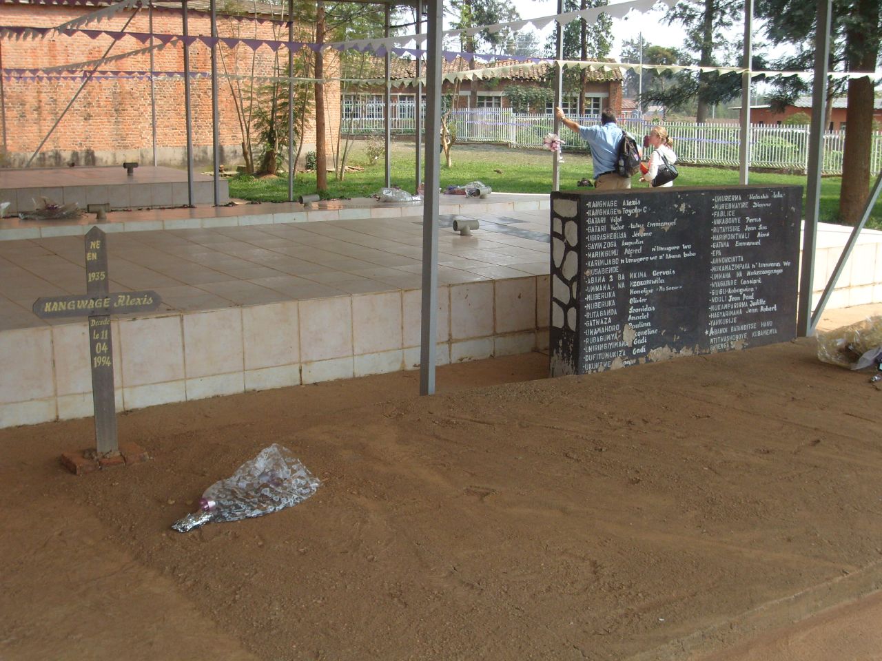 a sign and some dirt at a park