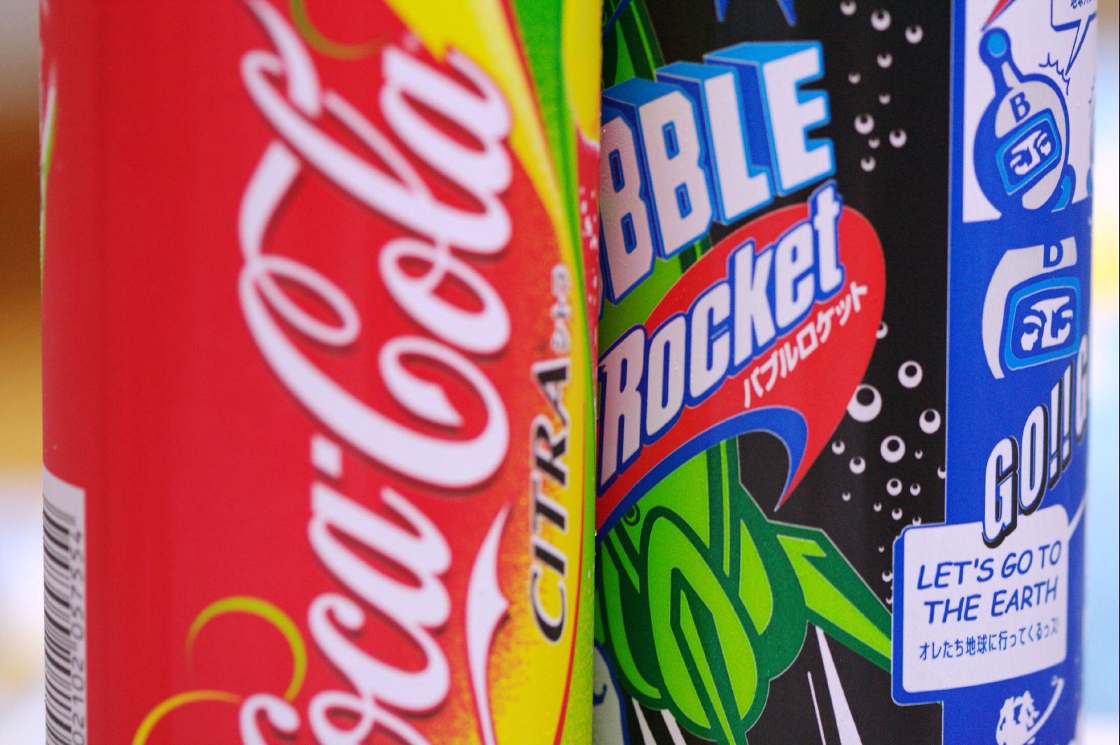 two can of sodas on a table