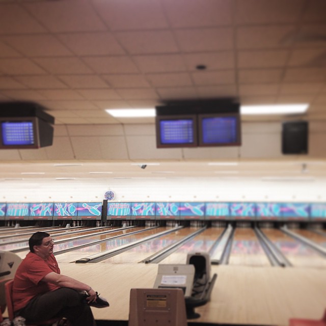 a bowling ball is going down the bowling pins