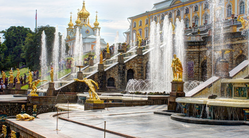 the fountains are in front of many old buildings