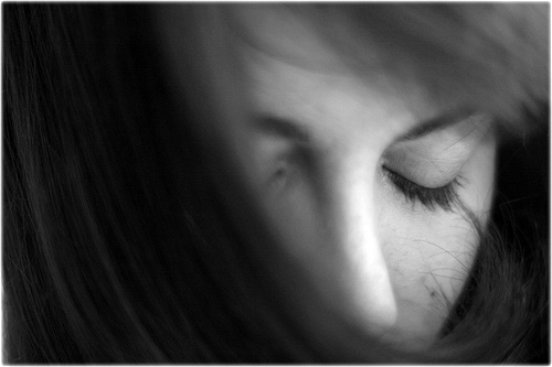 a person's nose with long eyelashes and eyeliner