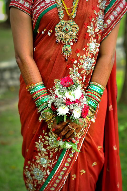 indian wedding dress being carried by the bride