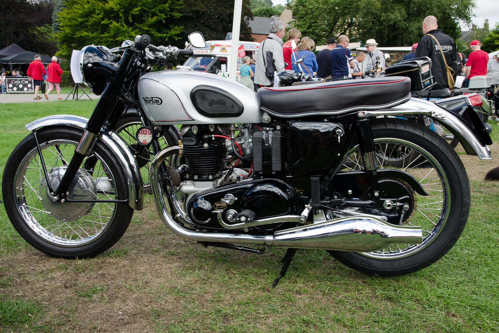 there is a silver and black motorcycle on display