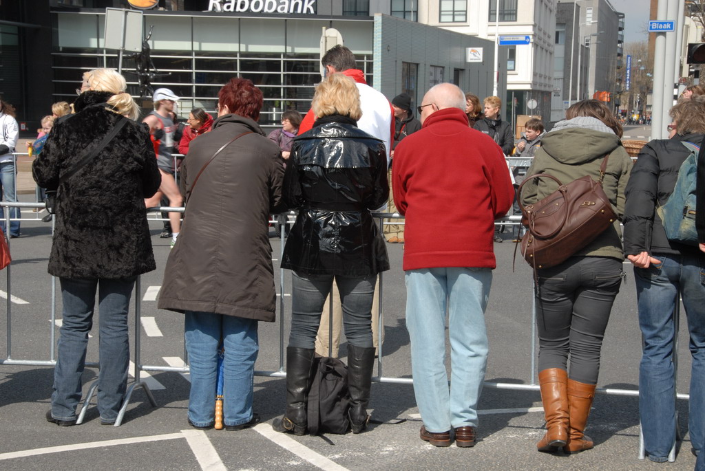 people wait on the corner to cast their vote