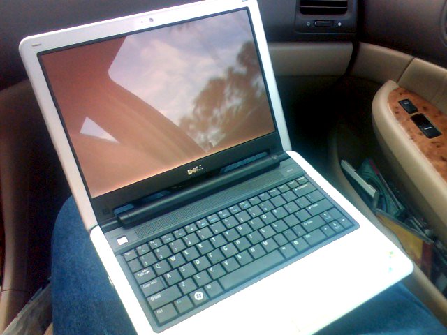an open laptop computer sitting on a persons lap
