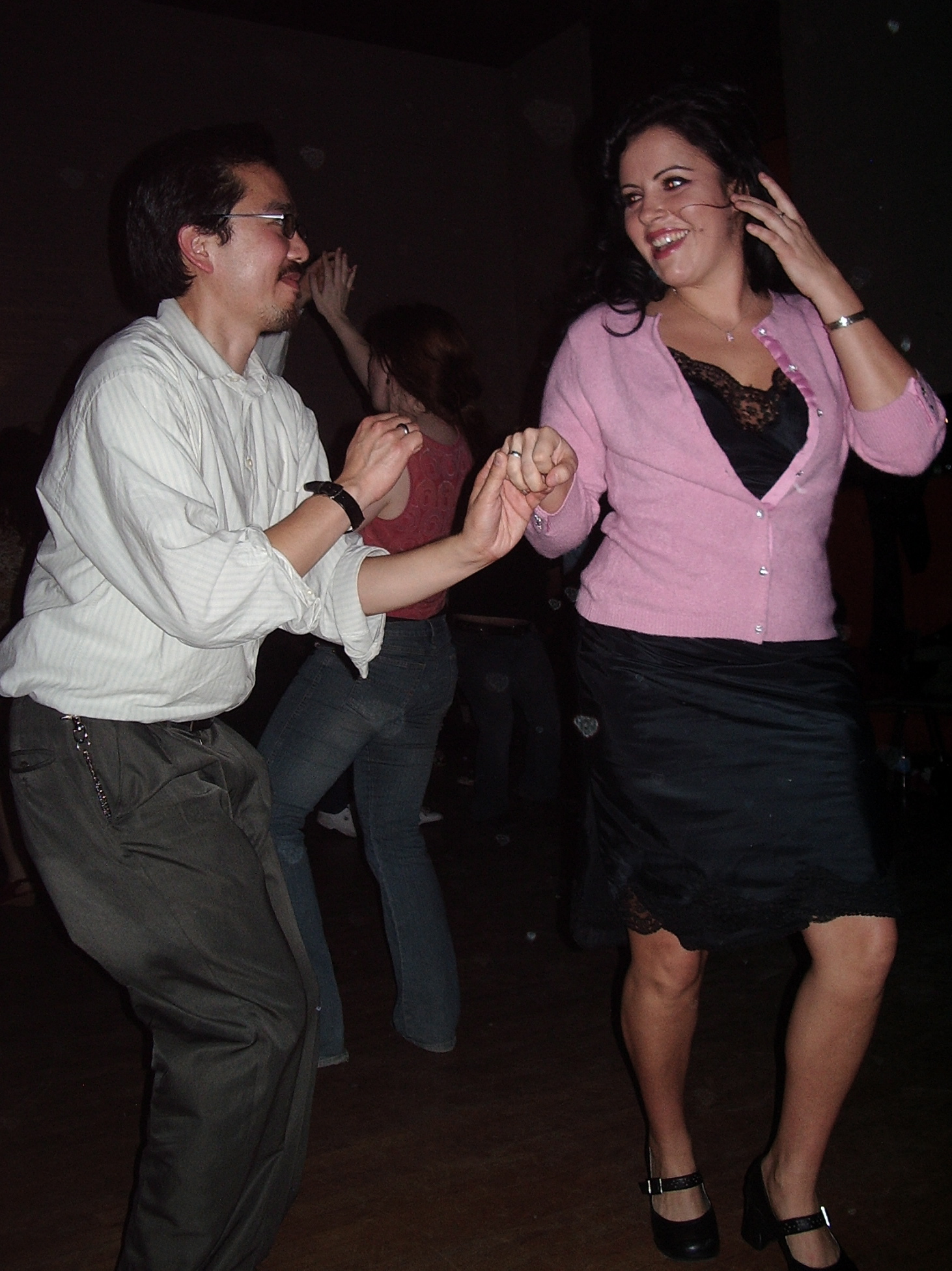 a man and woman dancing on a dance floor