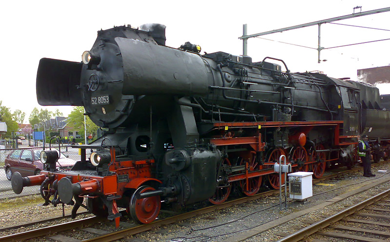 a large black train sitting on top of tracks