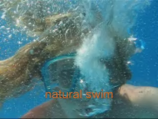a person swimming underwater with a brush and other stuff
