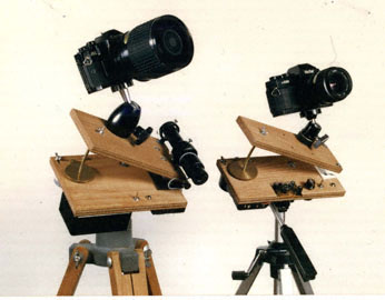 two large wooden telescopes are set on a tripod
