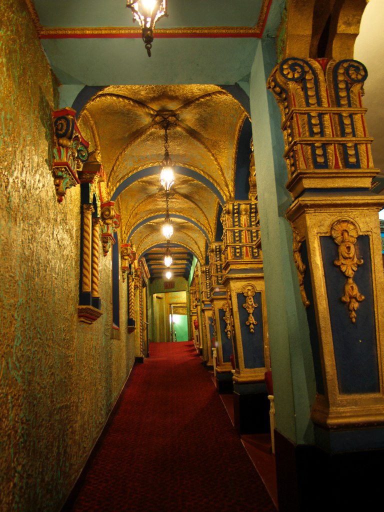 the hallway is lined with ornate wall and ceiling decorations