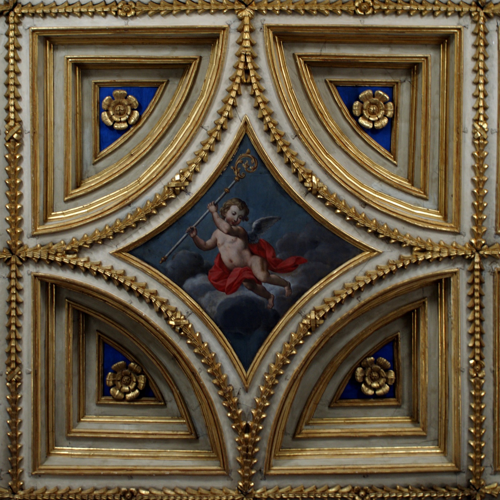 the golden painted ceiling of the cathedral shows a cherub