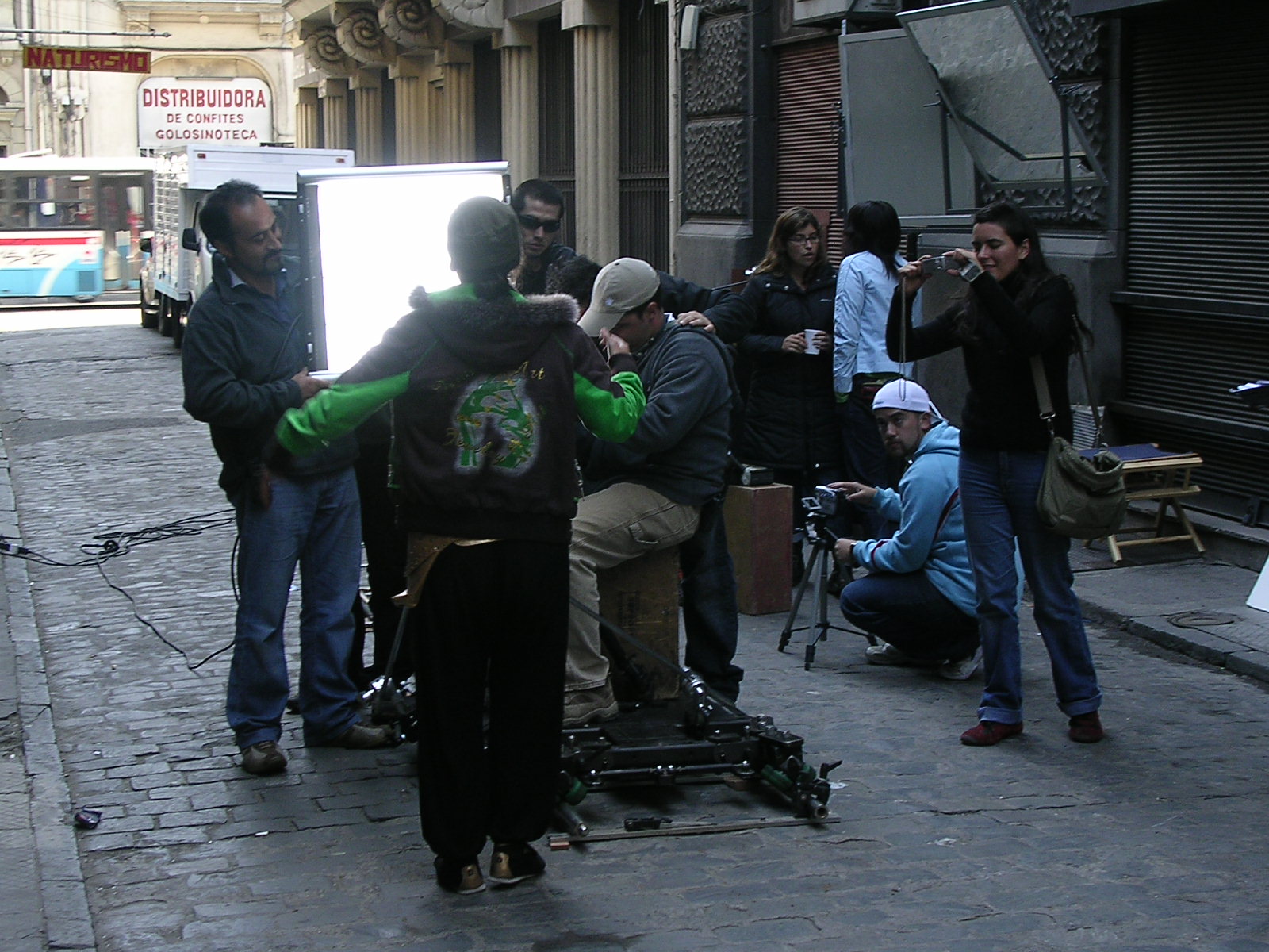 a group of people standing around each other