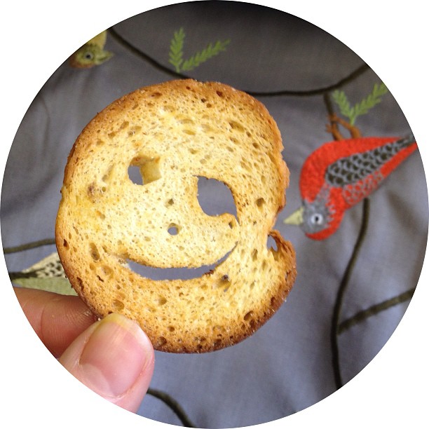 someone has the shape of a smiley face in a biscuit