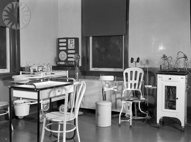 a room with a variety of chairs and tables