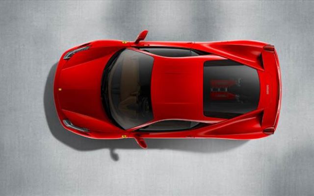 a red sports car is shown from above