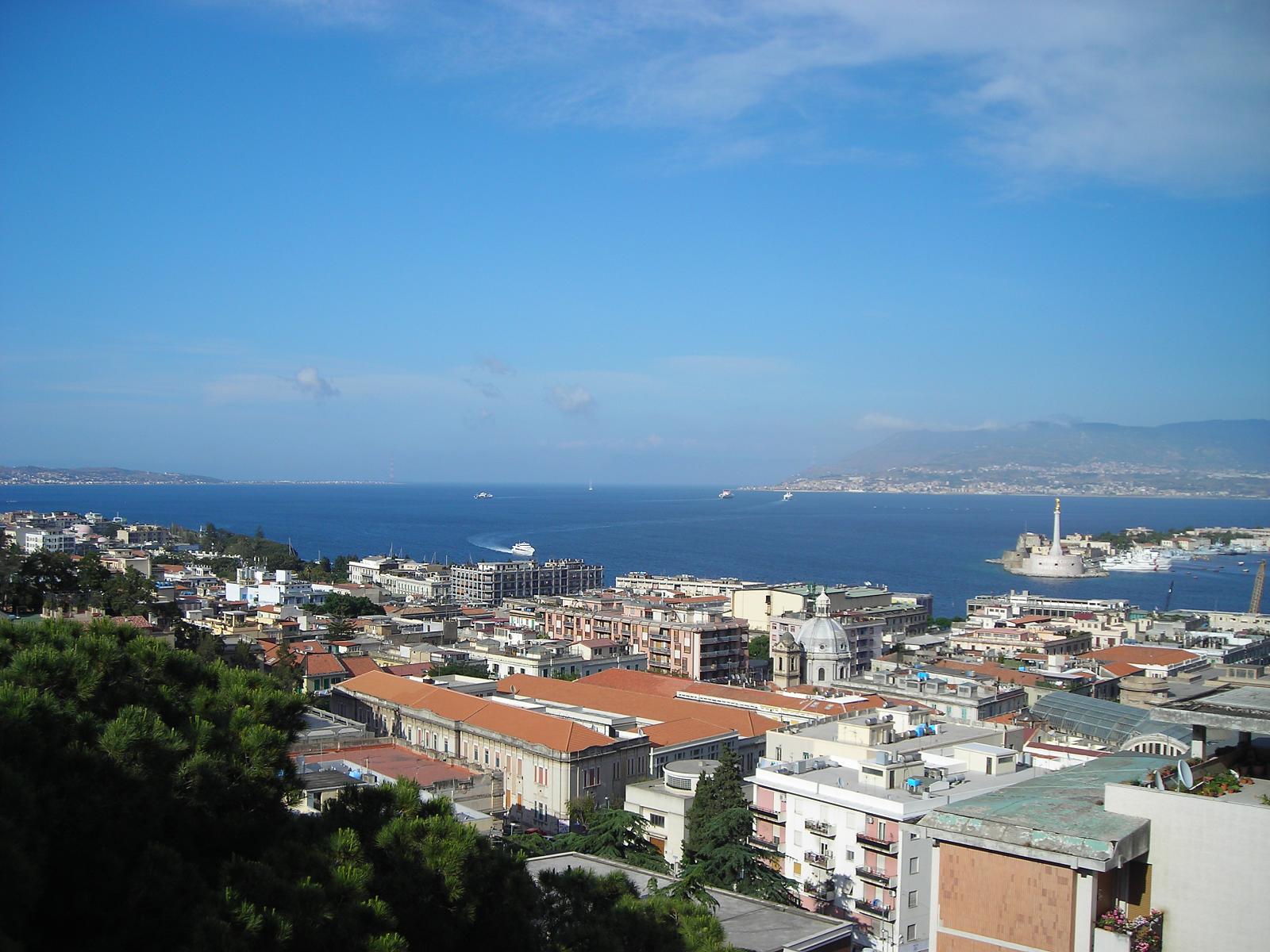 a view over a city near the ocean