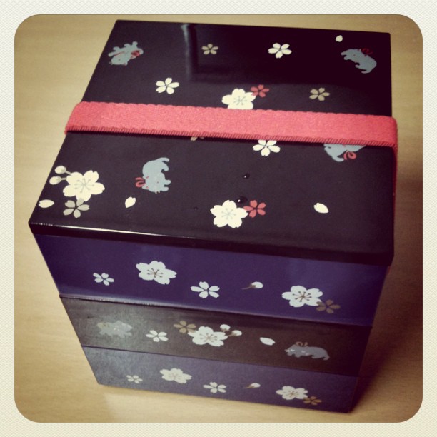 four decorated boxes that have flower designs on them