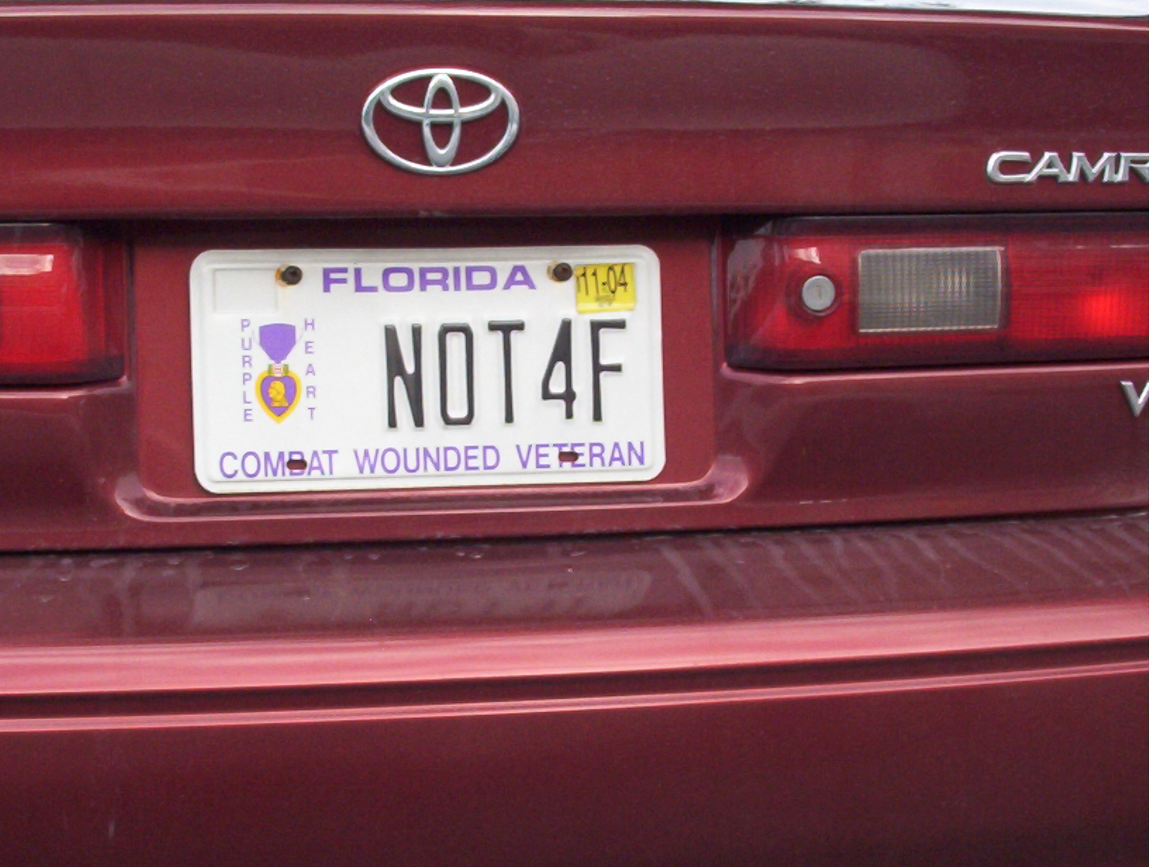this florida plate has been replaced to a red toyota