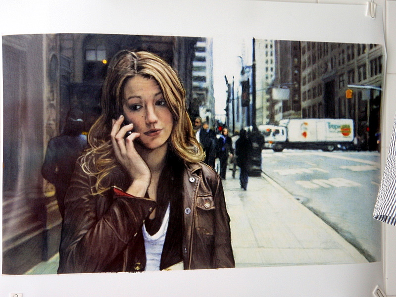 a poster of a beautiful blond woman on the phone
